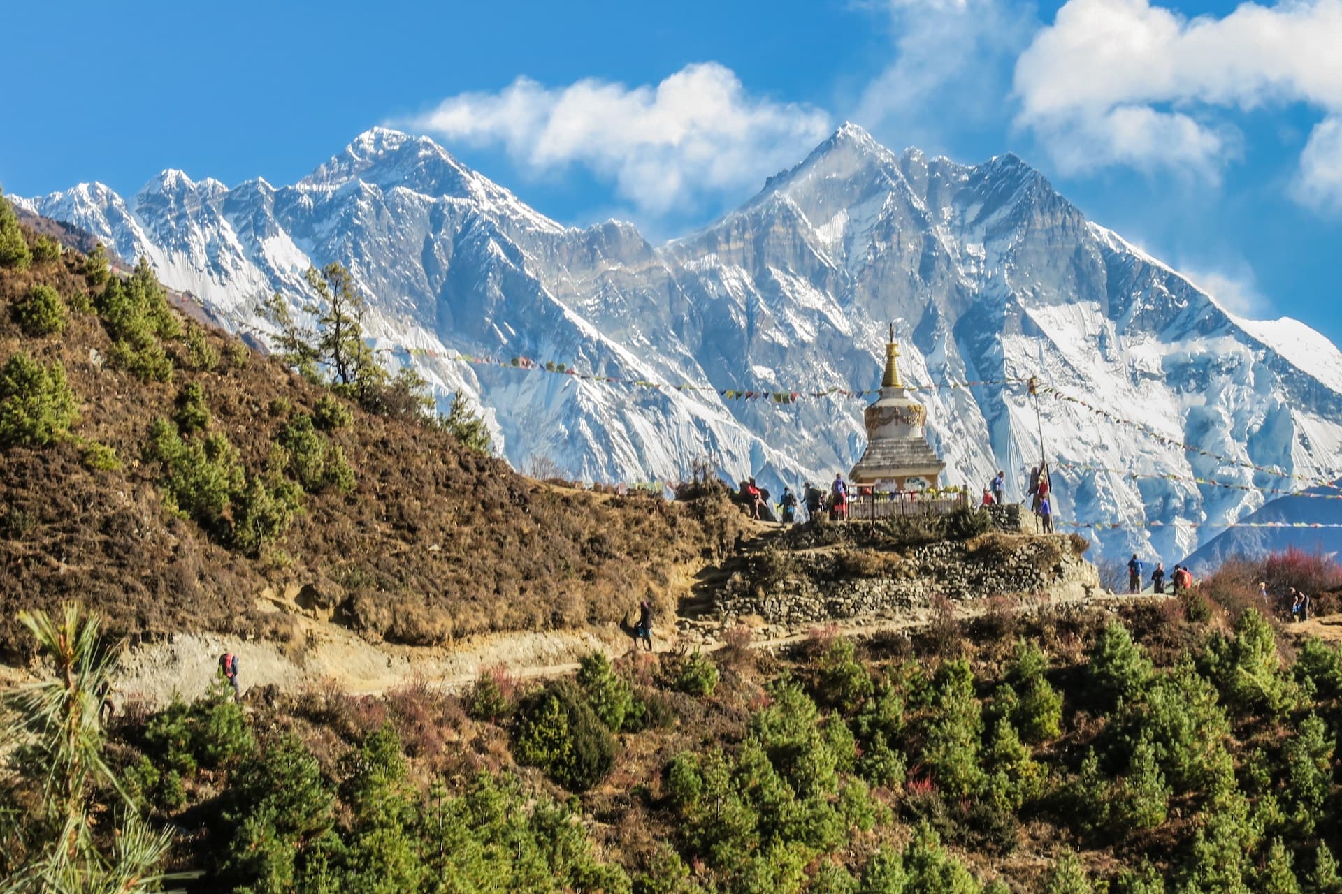 monastery in front of snow capped mountain