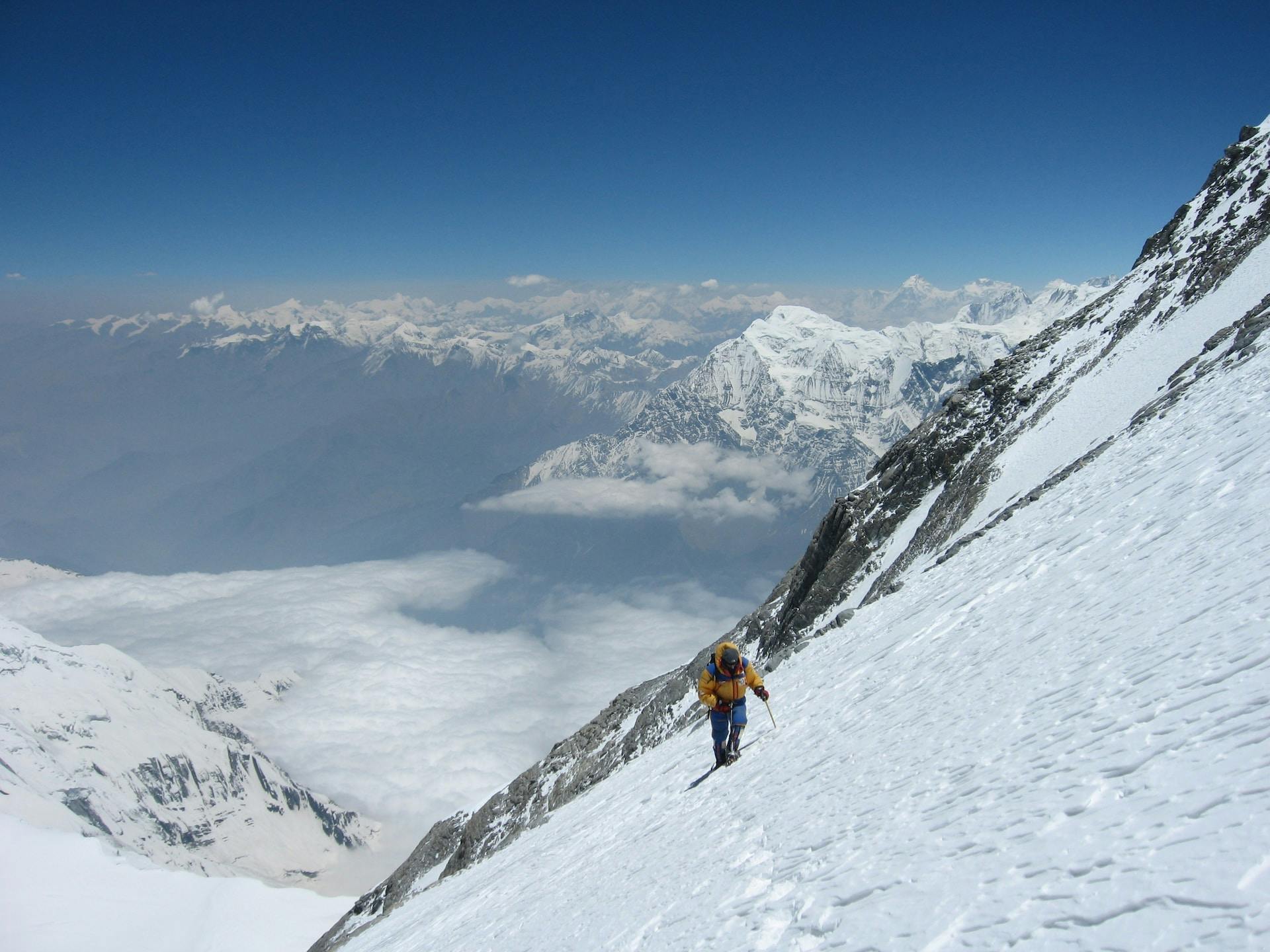 climber in snow covered mountain